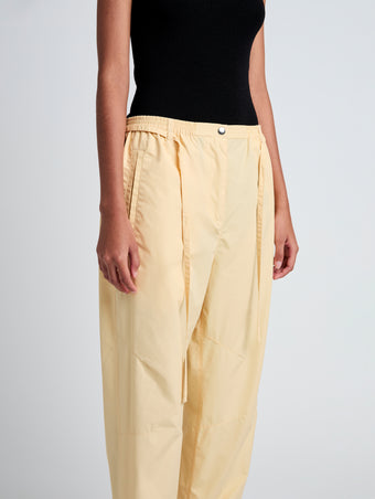 Proenza Schouler Detail image of model wearing Aston Pant in Tech Cotton in Light Wheat