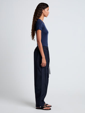 Proenza Schouler side full length image of model wearing Aston Pant in Tech Cotton in Navy