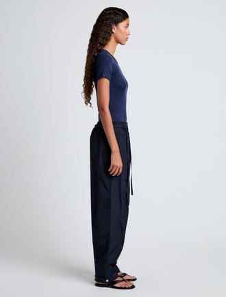 Proenza Schouler side full length image of model wearing Aston Pant in Tech Cotton in Navy