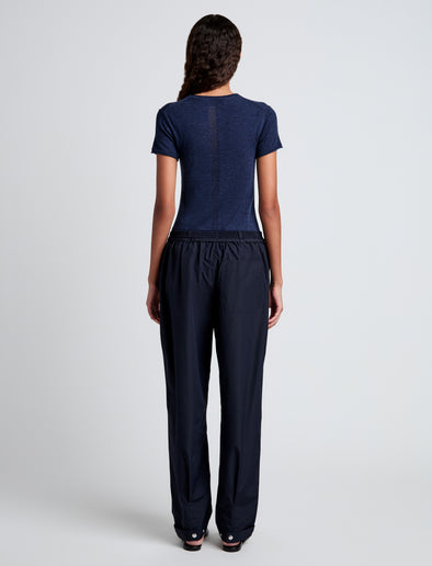 Proenza Schouler back full length image of model wearing Aston Pant in Tech Cotton in Navy