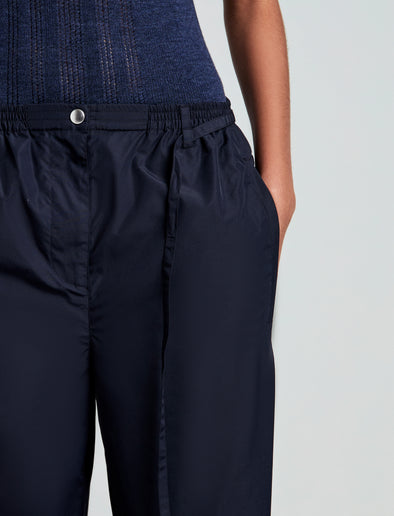 Proenza Schouler detail image of model wearing Aston Pant in Tech Cotton in Navy