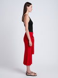 Proenza Schouler Side full length image of model wearing Phelan Knit Skirt in Linen Twist in Dark Poppy