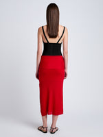 Proenza Schouler Back full length image of model wearing Phelan Knit Skirt in Linen Twist in Dark Poppy
