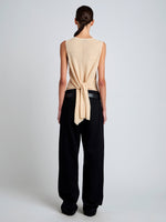 Proenza Schouler Back full length image of model wearing Heyde Knit Sweater in Linen Twist in Light Wheat