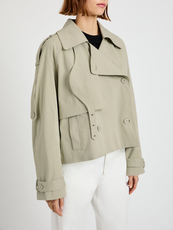 Proenza Schouler Detail image of model wearing Yasmin Cropped Trench in Cotton in Sage
