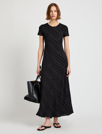 Proenza Schouler front image of model wearing Delphine Dress in Woven Stripe Flou in black/chalk