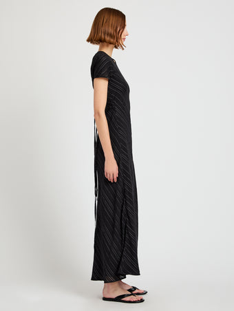Proenza Schouler side image of model wearing Delphine Dress in Woven Stripe Flou in black/chalk