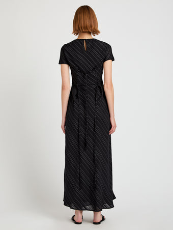 Proenza Schouler back image of model wearing Delphine Dress in Woven Stripe Flou in black/chalk