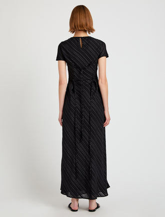Proenza Schouler back image of model wearing Delphine Dress in Woven Stripe Flou in black/chalk