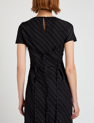 Proenza Schouler detail image of model wearing Delphine Dress in Woven Stripe Flou in black/chalk