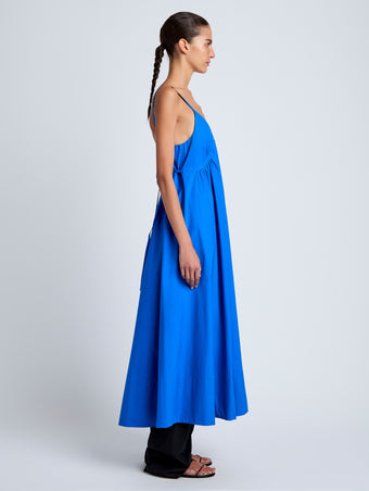Proenza Schouler Side full length image of model wearing Barker Dress in Stretch Poplin in Cyan