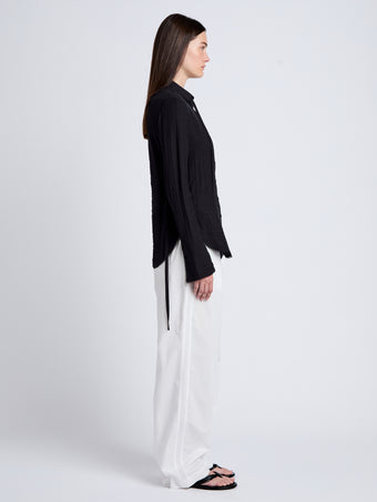 Proenza Schouler Side full length image of model wearing Cami Shirt in Crinkle Viscose in Black