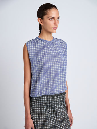 Proenza Schouler detail image of model wearing Bradley Crewneck in Plaid Knit in off white/denim