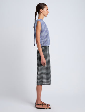 Proenza Schouler side image of model wearing Lori Knit Skirt in Plaid Knit in off white/black