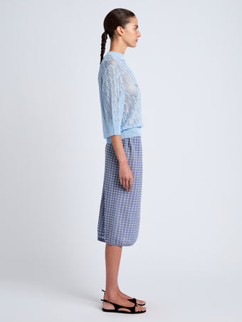 Proenza Schouler side image of model wearing Lori Knit Skirt in Plaid Knit in off white/denim