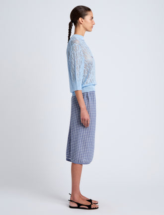Proenza Schouler side image of model wearing Lori Knit Skirt in Plaid Knit in off white/denim