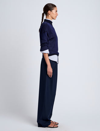 Proenza Schouler Side full length image of model wearing Shea Sweater in Plaited Viscose Rib in Dark Ink