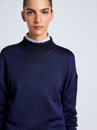 Proenza Schouler Detail image of model wearing Shea Sweater in Plaited Viscose Rib in Dark Ink