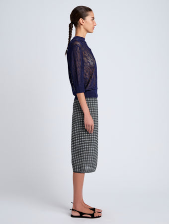 Proenza Schouler Side full length image of model wearing Nicola Knit Sweater in Plaited Viscose Rib in Dark Ink