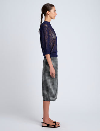 Proenza Schouler Side full length image of model wearing Nicola Knit Sweater in Plaited Viscose Rib in Dark Ink