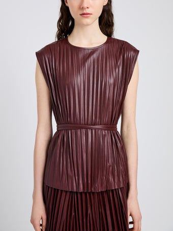 Proenza Schouler Detail image of model wearing Lyra Top in LW Faux Leather in Oxblood