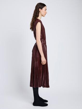 Proenza Schouler Side full length image of model wearing Rosalyn Skirt in Faux Leather in Oxblood
