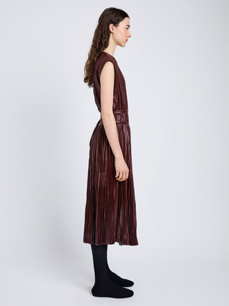 Proenza Schouler Side full length image of model wearing Rosalyn Skirt in Faux Leather in Oxblood