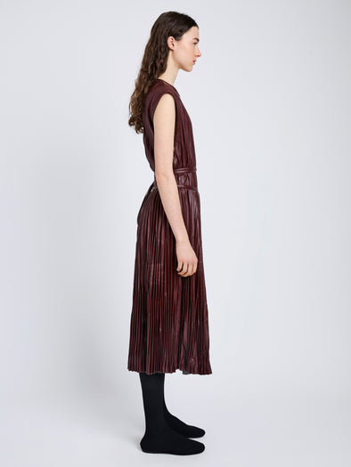 Proenza Schouler Side full length image of model wearing Rosalyn Skirt in Faux Leather in Oxblood