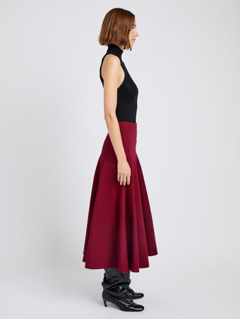 Proenza Schouler Side full length image of model wearing Heidi Skirt in Tech Cotton in Claret