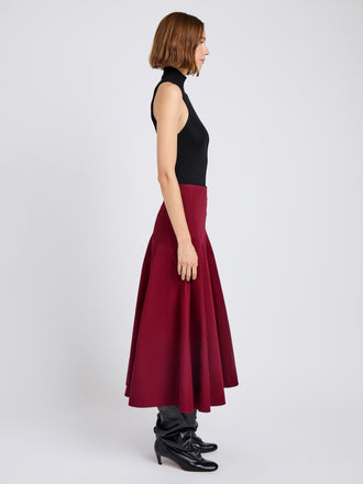 Proenza Schouler Side full length image of model wearing Heidi Skirt in Tech Cotton in Claret