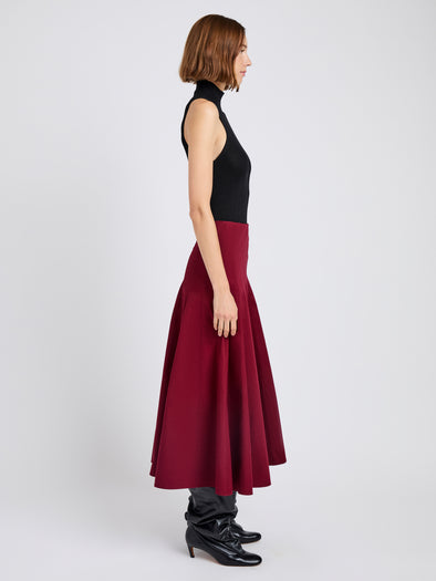 Proenza Schouler Side full length image of model wearing Heidi Skirt in Tech Cotton in Claret