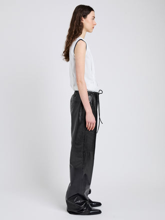Proenza Schouler Side full length image of model wearing Magnus Pant in Lightweight Leather in Black