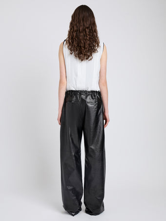 Proenza Schouler Back full length image of model wearing Magnus Pant in Lightweight Leather in Black
