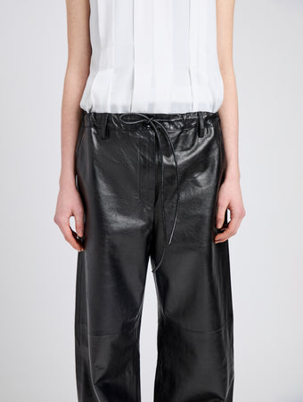 Proenza Schouler Detail image of model wearing Magnus Pant in Lightweight Leather in Black