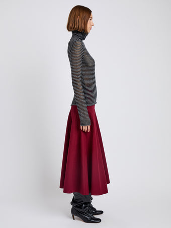 Proenza Schouler Side full length image of model wearing Hailey Sweater in Cashmere Silk Stripe in Grey, black