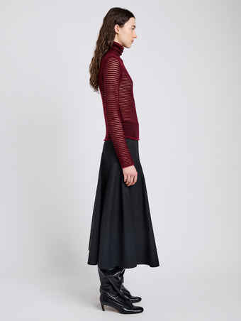 Proenza Schouler Side full length image of model wearing Hailey Sweater in Cashmere Silk Stripe in Claret, black