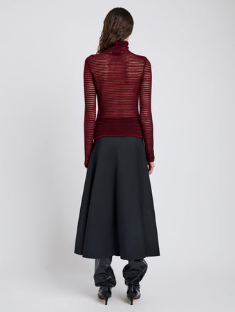Proenza Schouler Back full length image of model wearing Hailey Sweater in Cashmere Silk Stripe in Claret, black
