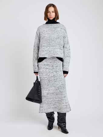Proenza Schouler Front full length image of model wearing Maddox Sweater in Marled Cotton in Bone, black melange
