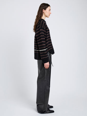 Proenza Schouler Side full length image of model wearing Leonie Sweater in Stripe Wool in Black Multi