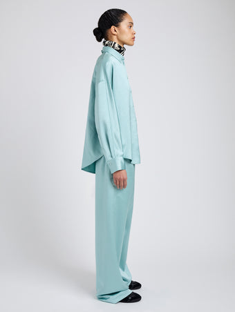 Proenza Schouler Side full length image of model wearing Caroline Shirt in Crinkled Crepe in Sea Glass