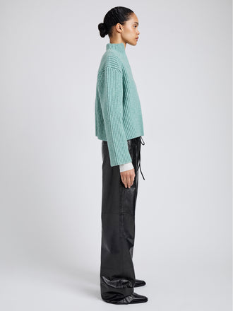 Proenza Schouler Side full length image of model wearing Meron Sweater in Melange Merino in Sea Glass Melange