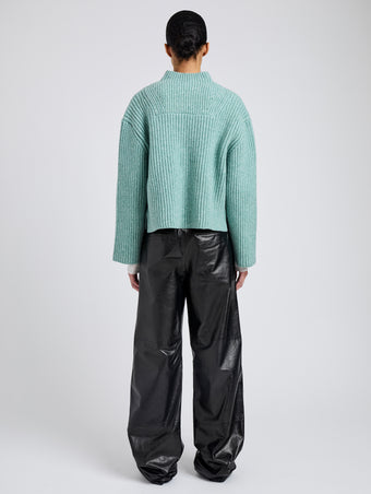Proenza Schouler Back full length image of model wearing Meron Sweater in Melange Merino in Sea Glass Melange