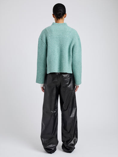 Proenza Schouler Back full length image of model wearing Meron Sweater in Melange Merino in Sea Glass Melange