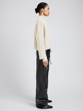 Proenza Schouler Side full length image of model wearing Meron Sweater in Melange Merino in Off White Melange