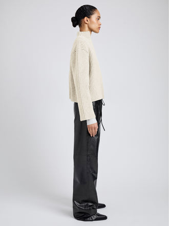 Proenza Schouler Side full length image of model wearing Meron Sweater in Melange Merino in Off White Melange