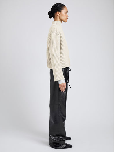 Proenza Schouler Side full length image of model wearing Meron Sweater in Melange Merino in Off White Melange