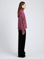 Proenza Schouler Side full length image of model wearing Sol Sweater in Melange Alpaca in Wine Melange