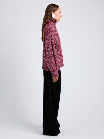 Proenza Schouler Side full length image of model wearing Sol Sweater in Melange Alpaca in Wine Melange