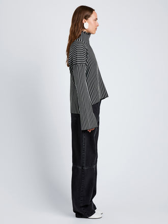Proenza Schouler Side full length image of model wearing Elysia Sweater in Ladder Stripe Knits in BlackWhite