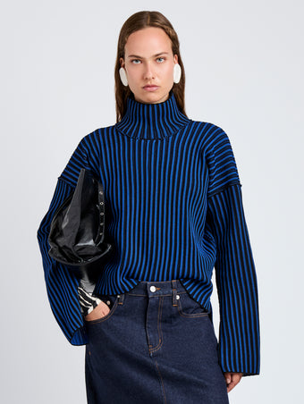 Proenza Schouler Front cropped image of model wearing Elysia Sweater in Ladder Stripe Knits in BlueBlack